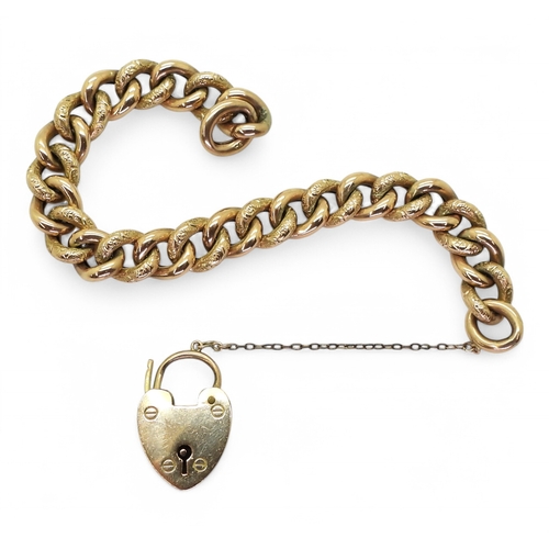 2725 - A 9CT GOLD CURB CHAIN BRACELETwith heart shaped clasp and alternate patterned links. Hallmarked Birm... 