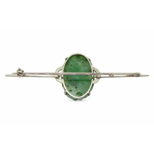 2727 - CHINESE GREEN HARDSTONE JEWELSA 9ct white gold brooch set with a fruit carved and pierced oval hards... 