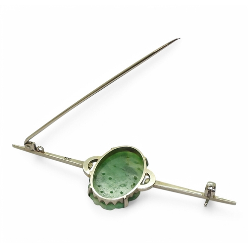 2727 - CHINESE GREEN HARDSTONE JEWELSA 9ct white gold brooch set with a fruit carved and pierced oval hards... 