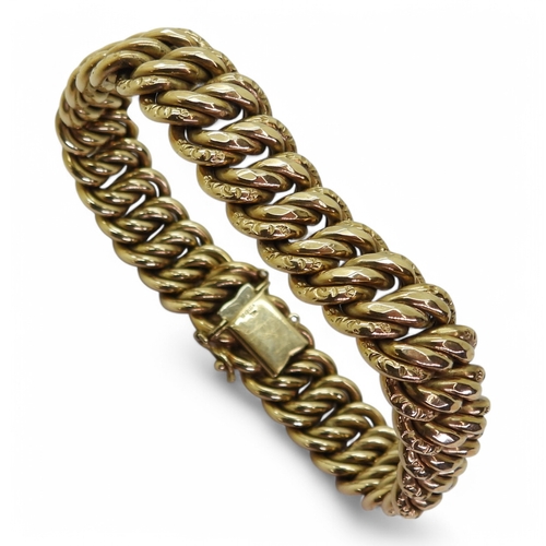 2728 - A DOUBLE CURB LINK BRACELETin a vintage style, made in 9ct gold with Birmingham import marks for 197... 