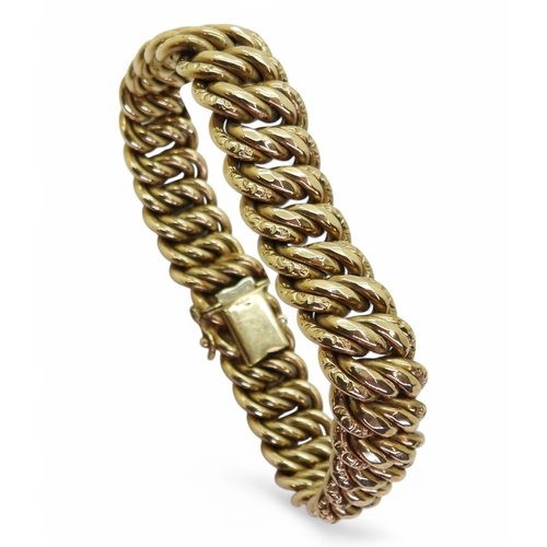 2728 - A DOUBLE CURB LINK BRACELETin a vintage style, made in 9ct gold with Birmingham import marks for 197... 