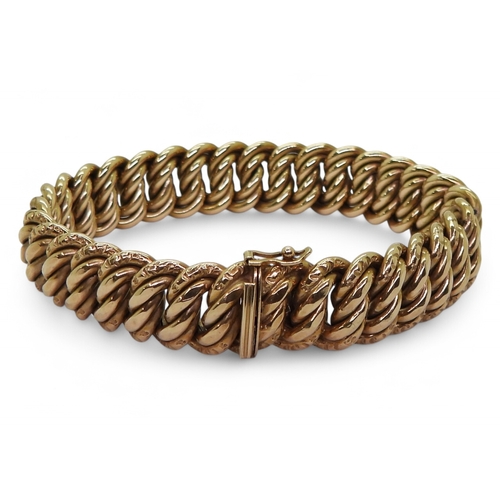 2728 - A DOUBLE CURB LINK BRACELETin a vintage style, made in 9ct gold with Birmingham import marks for 197... 