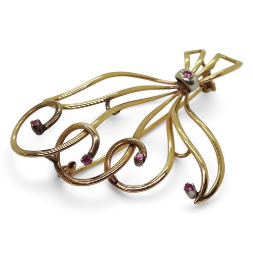 2731 - AN ITALIAN BROOCHstamped with Italian hallmarks for 18k gold, set with synthetic rubies. Dimensions ... 