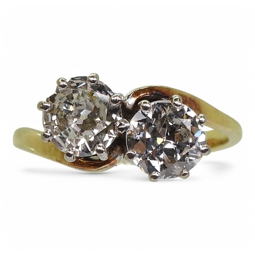 2738 - A TWIN STONE DIAMOND RINGmounted in 18ct yellow and white gold, and set with two diamonds with an es... 