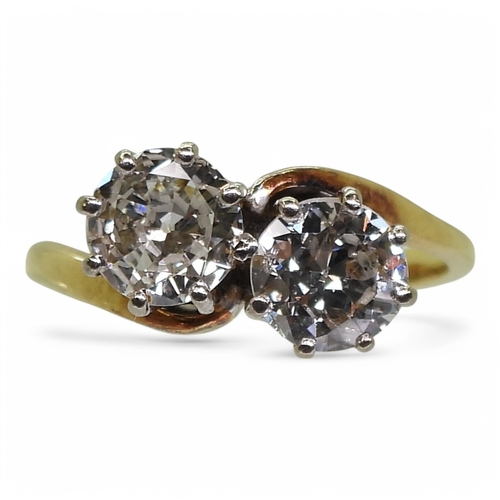 2738 - A TWIN STONE DIAMOND RINGmounted in 18ct yellow and white gold, and set with two diamonds with an es... 