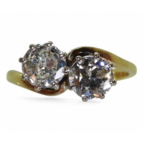 2738 - A TWIN STONE DIAMOND RINGmounted in 18ct yellow and white gold, and set with two diamonds with an es... 