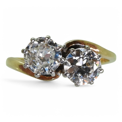 2738 - A TWIN STONE DIAMOND RINGmounted in 18ct yellow and white gold, and set with two diamonds with an es... 