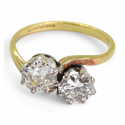 2738 - A TWIN STONE DIAMOND RINGmounted in 18ct yellow and white gold, and set with two diamonds with an es... 