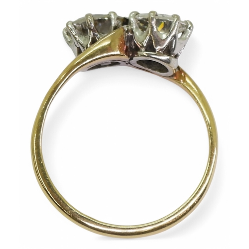 2738 - A TWIN STONE DIAMOND RINGmounted in 18ct yellow and white gold, and set with two diamonds with an es... 