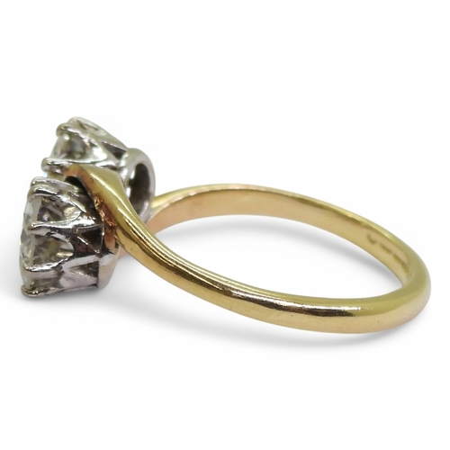 2738 - A TWIN STONE DIAMOND RINGmounted in 18ct yellow and white gold, and set with two diamonds with an es... 