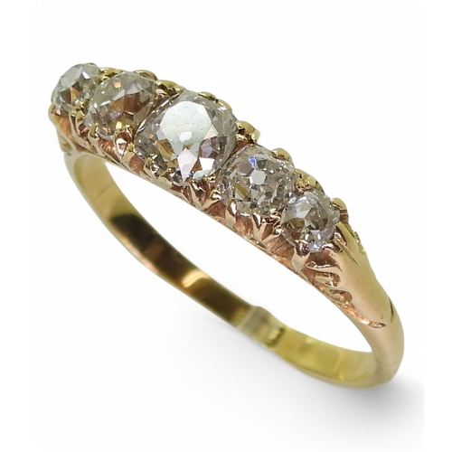 2741 - AN OLD CUT DIAMOND RINGwith a classic 18ct gold scroll mount. The five diamonds have an estimated ap... 