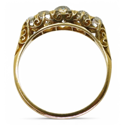 2741 - AN OLD CUT DIAMOND RINGwith a classic 18ct gold scroll mount. The five diamonds have an estimated ap... 