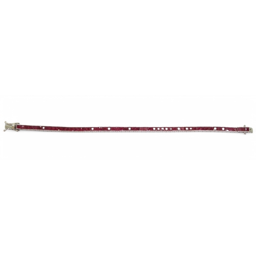 2746 - RUBY LINE BRACELETset with fifty seven square cut rubies in tension settings, the mount in 18ct whit... 