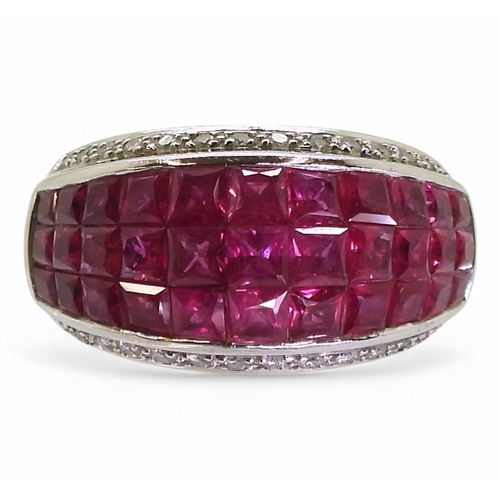 2748 - A RUBY AND DIAMOND RINGmounted in 18k white gold, with a three row panel of tile set square cut rubi... 