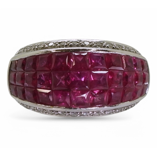 2748 - A RUBY AND DIAMOND RINGmounted in 18k white gold, with a three row panel of tile set square cut rubi... 