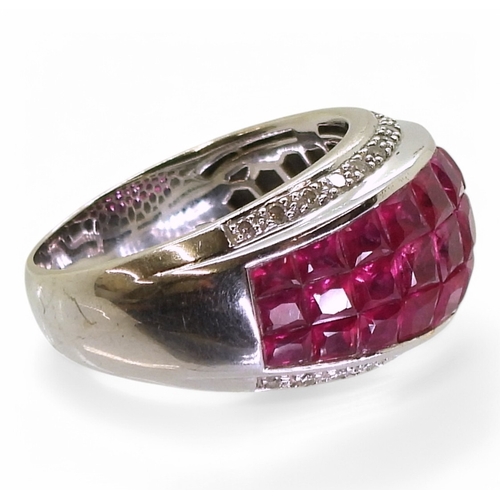 2748 - A RUBY AND DIAMOND RINGmounted in 18k white gold, with a three row panel of tile set square cut rubi... 