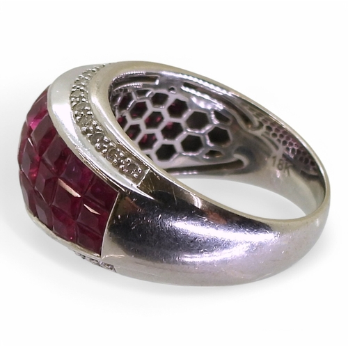 2748 - A RUBY AND DIAMOND RINGmounted in 18k white gold, with a three row panel of tile set square cut rubi... 