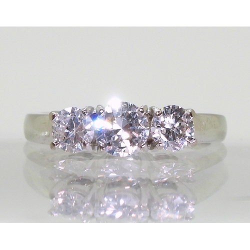 2751 - A THREE STONE DIAMOND RINGset with estimated approx 1.04cts of brilliant cut diamonds. Finger size M... 