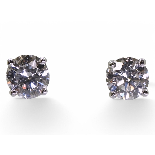 2752 - DIAMOND STUD EARRINGSthe two brilliant cut diamond of 0.75cts and 0.76cts are set in 18ct gold four ... 