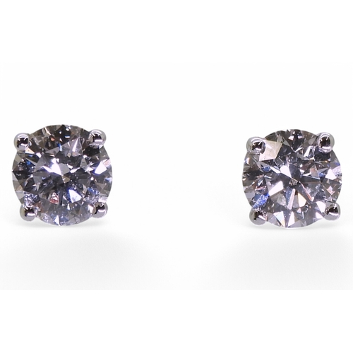 2752 - DIAMOND STUD EARRINGSthe two brilliant cut diamond of 0.75cts and 0.76cts are set in 18ct gold four ... 