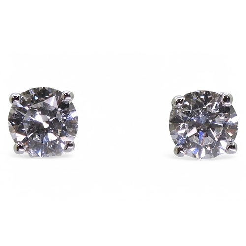 2752 - DIAMOND STUD EARRINGSthe two brilliant cut diamond of 0.75cts and 0.76cts are set in 18ct gold four ... 