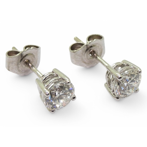 2752 - DIAMOND STUD EARRINGSthe two brilliant cut diamond of 0.75cts and 0.76cts are set in 18ct gold four ... 