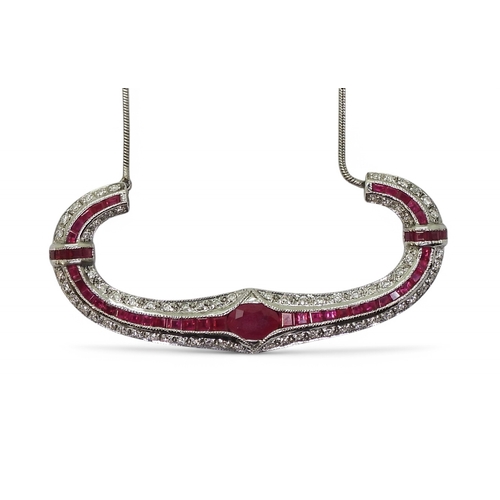 2756 - A RUBY & DIAMOND NECKLACEwith a central oval cut ruby of approx 7mm x 5mm , with further mixed c... 