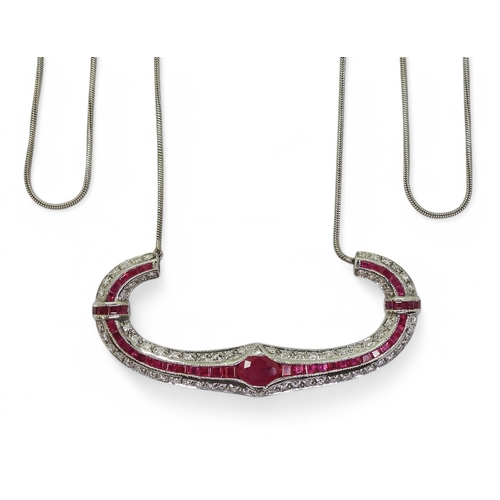 2756 - A RUBY & DIAMOND NECKLACEwith a central oval cut ruby of approx 7mm x 5mm , with further mixed c... 