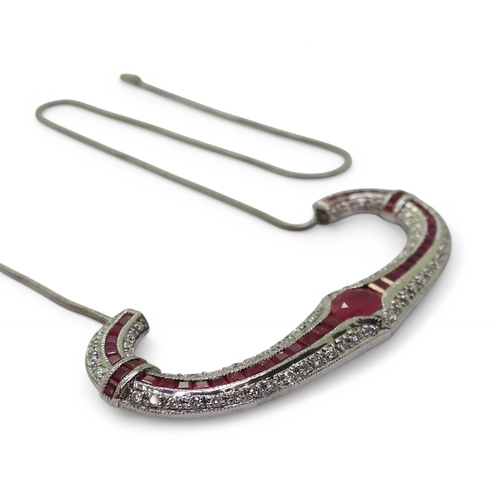 2756 - A RUBY & DIAMOND NECKLACEwith a central oval cut ruby of approx 7mm x 5mm , with further mixed c... 