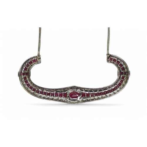 2756 - A RUBY & DIAMOND NECKLACEwith a central oval cut ruby of approx 7mm x 5mm , with further mixed c... 