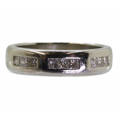 2762 - A GENTS WEDDING RINGthe platinum ring is set with nine princess cut diamonds with an estimated combi... 