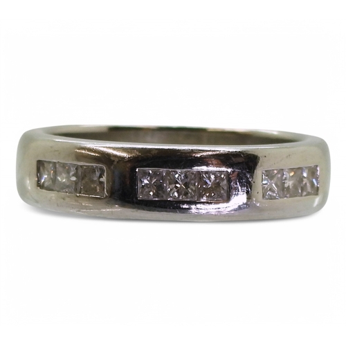 2762 - A GENTS WEDDING RINGthe platinum ring is set with nine princess cut diamonds with an estimated combi... 