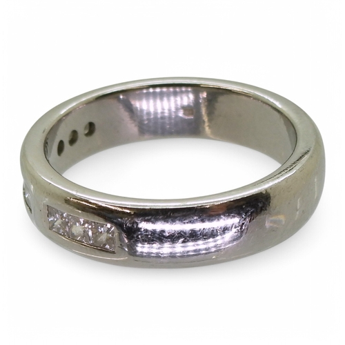 2762 - A GENTS WEDDING RINGthe platinum ring is set with nine princess cut diamonds with an estimated combi... 