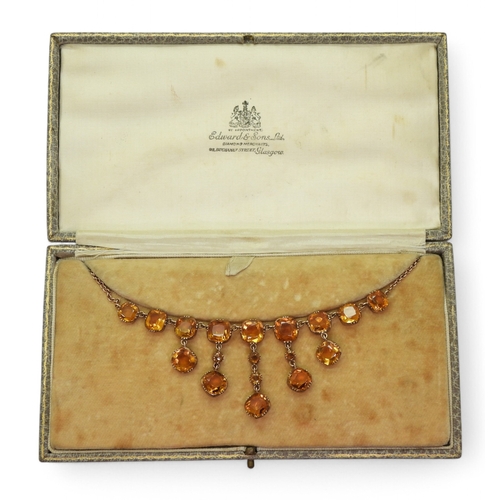 2766 - A VINTAGE CITRINE NECKLACEon a fine yellow metal trace chain, each citrine is cushion cut and gently... 