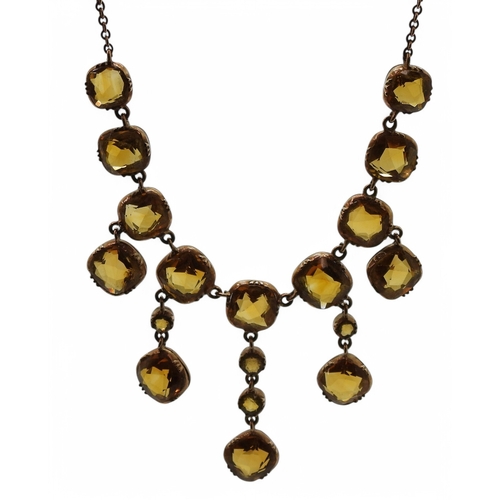 2766 - A VINTAGE CITRINE NECKLACEon a fine yellow metal trace chain, each citrine is cushion cut and gently... 