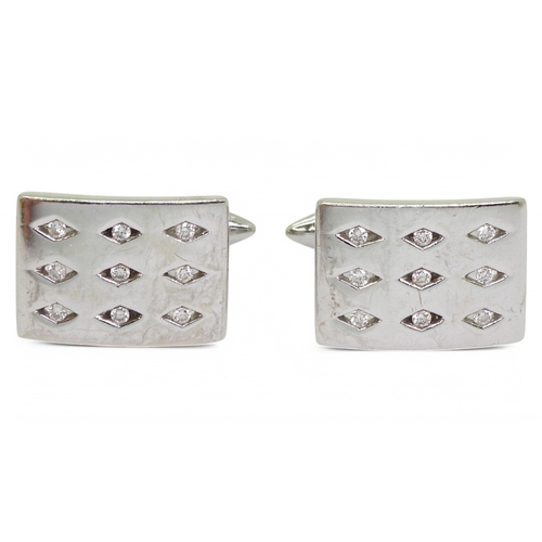 2769 - A PAIR OF DIAMOND CUFFLINKSmade in 9ct white gold each cufflink is set with nine brilliant cuts in d... 