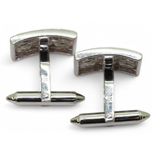 2769 - A PAIR OF DIAMOND CUFFLINKSmade in 9ct white gold each cufflink is set with nine brilliant cuts in d... 