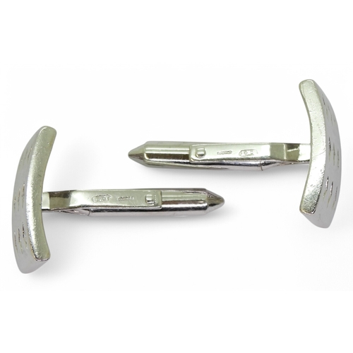 2769 - A PAIR OF DIAMOND CUFFLINKSmade in 9ct white gold each cufflink is set with nine brilliant cuts in d... 