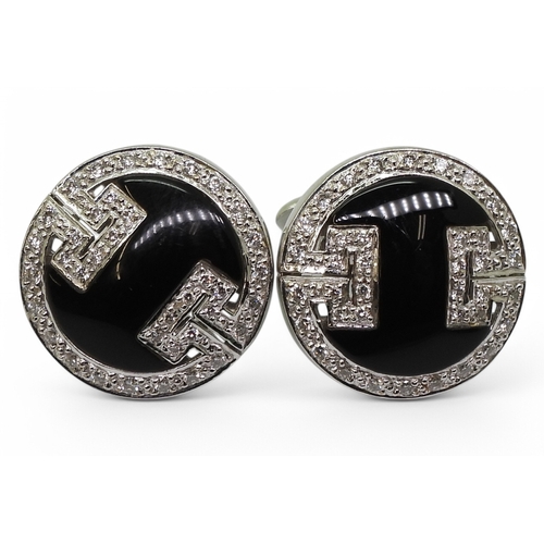 2771 - ONYX & DIAMOND CUFFLINKSmade in 18ct white gold with a key pattern picked out in pave set diamon... 