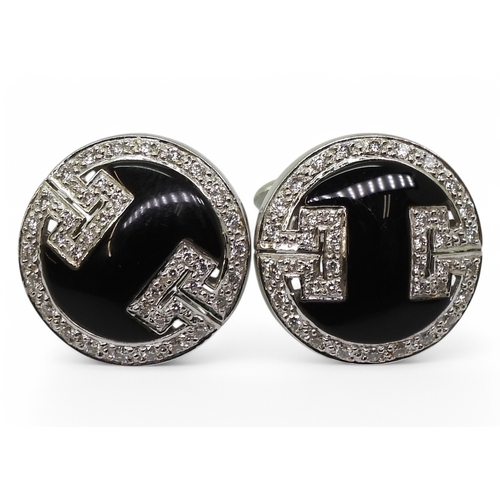 2771 - ONYX & DIAMOND CUFFLINKSmade in 18ct white gold with a key pattern picked out in pave set diamon... 