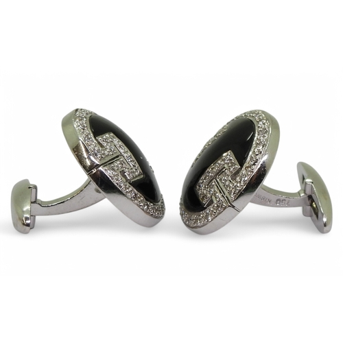 2771 - ONYX & DIAMOND CUFFLINKSmade in 18ct white gold with a key pattern picked out in pave set diamon... 