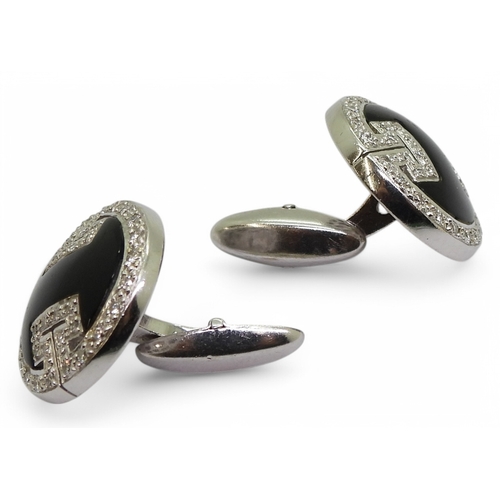 2771 - ONYX & DIAMOND CUFFLINKSmade in 18ct white gold with a key pattern picked out in pave set diamon... 