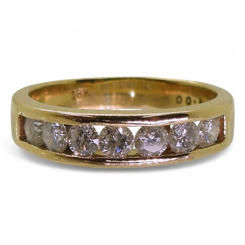 2772 - AN ETERNITY RINGmade in 18ct yellow gold and set with seven diamonds, with an estimated approx diamo... 