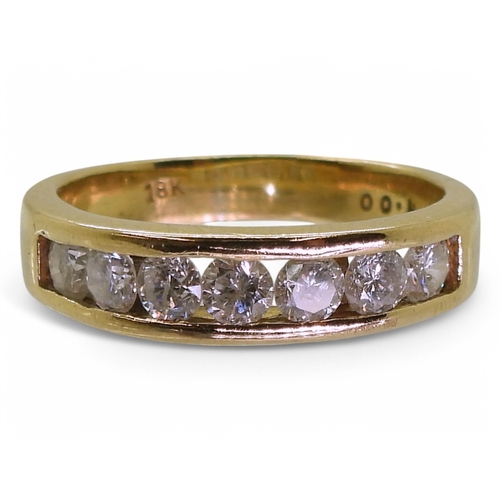 2772 - AN ETERNITY RINGmade in 18ct yellow gold and set with seven diamonds, with an estimated approx diamo... 