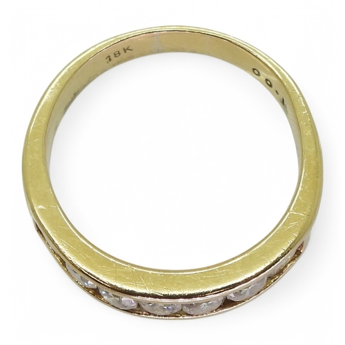 2772 - AN ETERNITY RINGmade in 18ct yellow gold and set with seven diamonds, with an estimated approx diamo... 