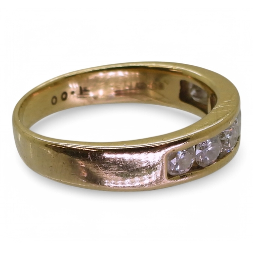 2772 - AN ETERNITY RINGmade in 18ct yellow gold and set with seven diamonds, with an estimated approx diamo... 