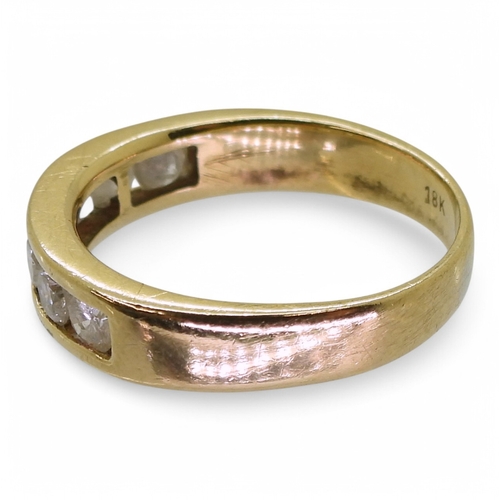 2772 - AN ETERNITY RINGmade in 18ct yellow gold and set with seven diamonds, with an estimated approx diamo... 