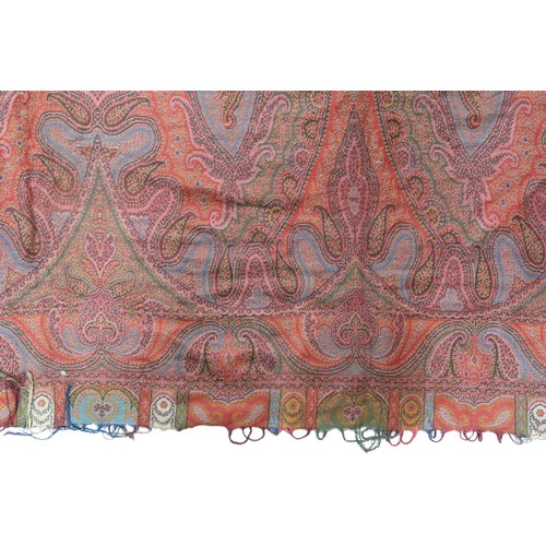 6002 - A large Paisley shawl, with central quartered decoration with green, red, cream and blue ground, 154... 