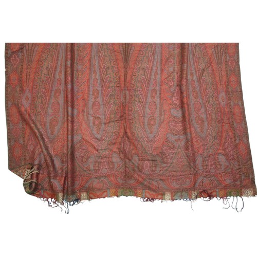 6002 - A large Paisley shawl, with central quartered decoration with green, red, cream and blue ground, 154... 