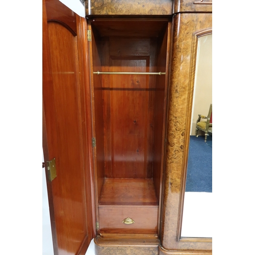 2015 - A VICTORIAN BURR WALNUT VENEERED THREE PIECE BEDROOM SUITEconsisting four door break front wardrobe ... 